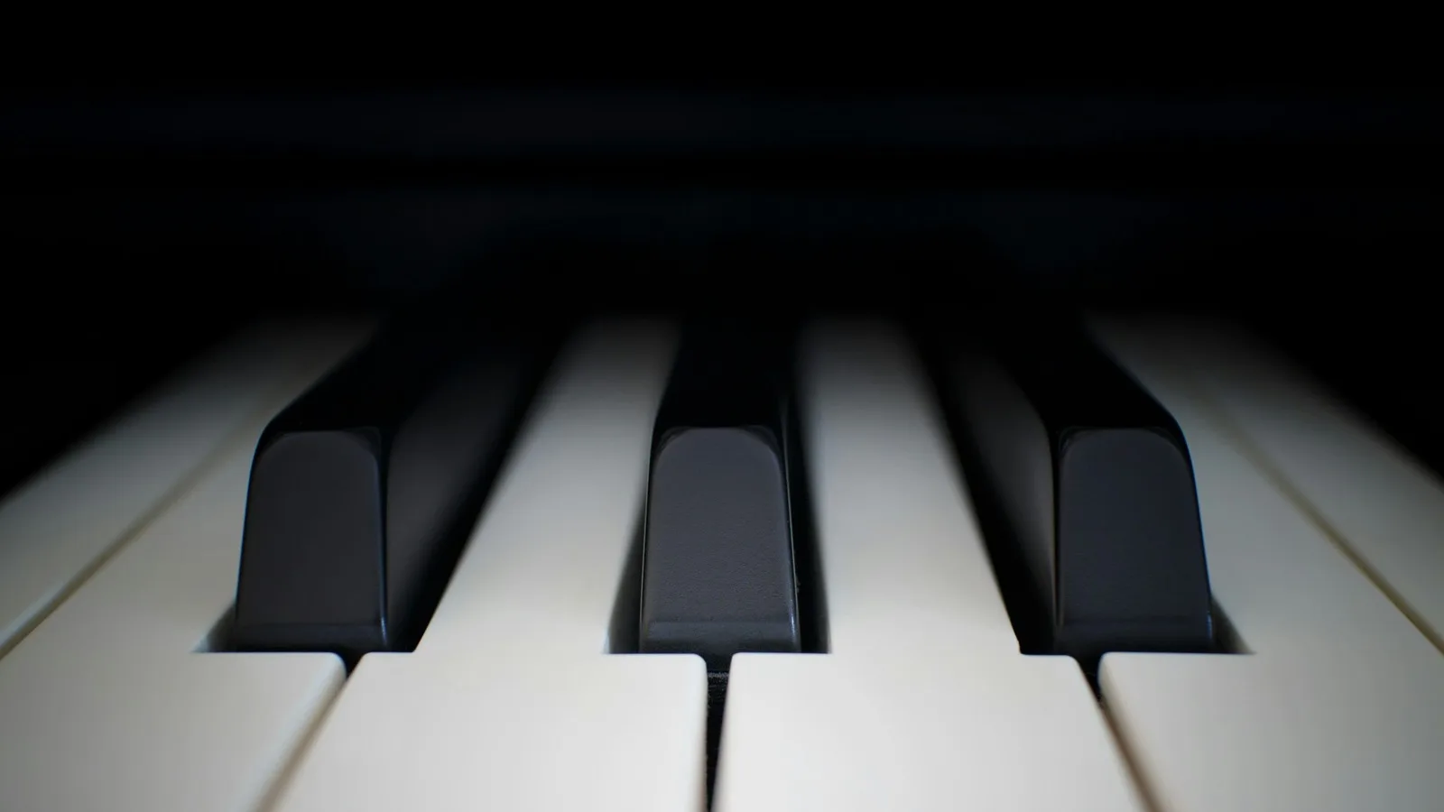 A piano keyboard photographed from directly above, keys running off both edges